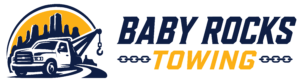 Baby Rocks Towing logo featuring a blue tow truck on a winding road with a yellow sun and dark mountain rock silhouettes in the background, flanked by chain link icons.